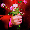 Girl holding wild clover flowers